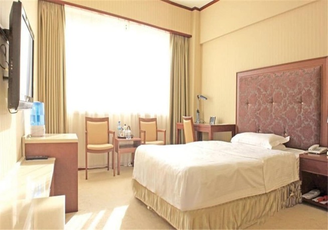 Imagen de la habitación del Hotel Dalian Royal. Foto 11