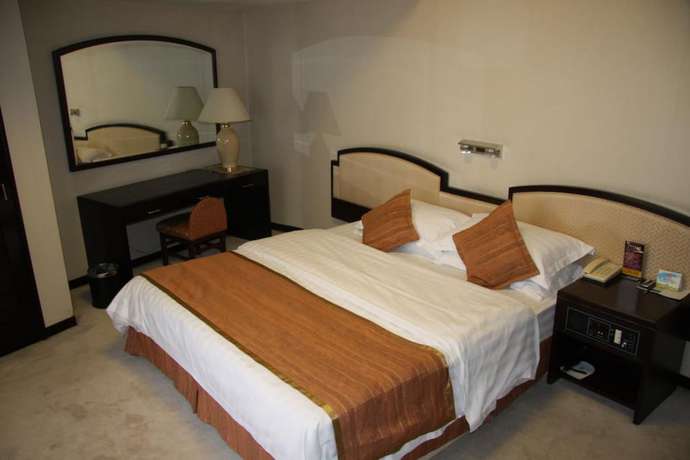 Imagen de la habitación del Hotel Dalian Royal. Foto 13