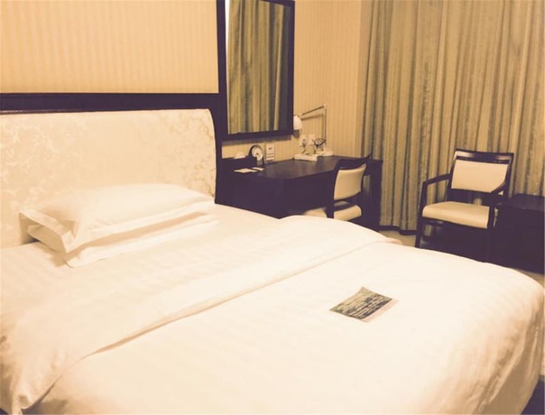 Imagen de la habitación del Hotel Dalian Royal. Foto 14