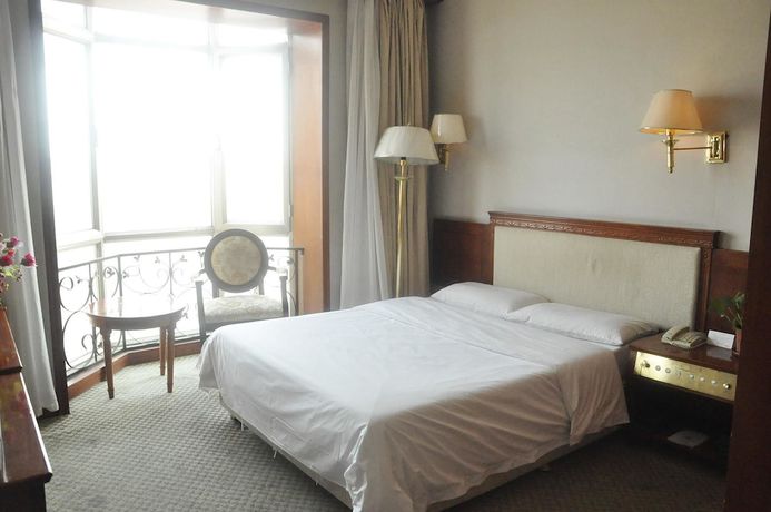 Imagen de la habitación del Hotel Dalian Sanhe. Foto 4