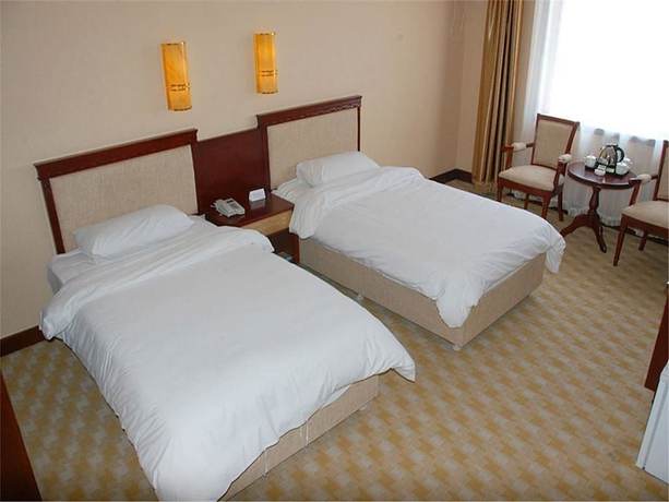 Imagen de la habitación del Hotel Dalian Sanhe. Foto 9