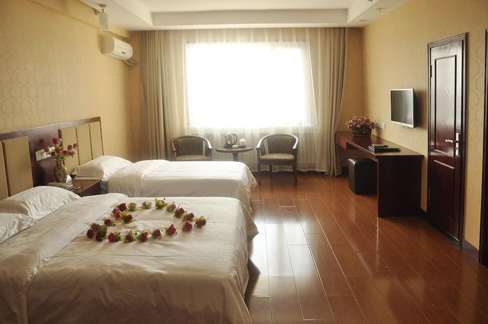 Imagen de la habitación del Hotel Dalian Sanhe. Foto 12