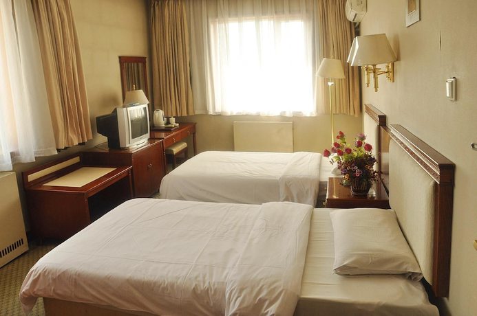 Imagen de la habitación del Hotel Dalian Sanhe. Foto 13