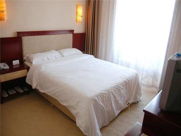 Imagen de la habitación del Hotel Dalian Sanhe. Foto 15