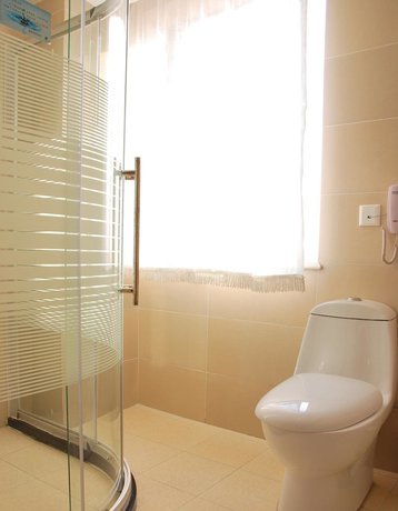 Imagen de la habitación del Hotel Dalian Sanhe. Foto 16