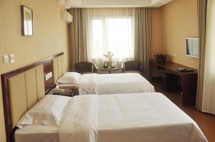 Imagen de la habitación del Hotel Dalian Sanhe. Foto 18