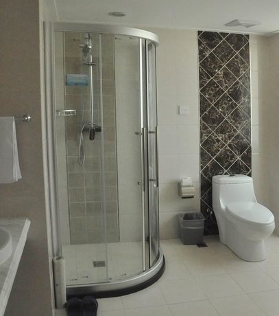 Imagen de la habitación del Hotel Dalian Sanhe. Foto 20
