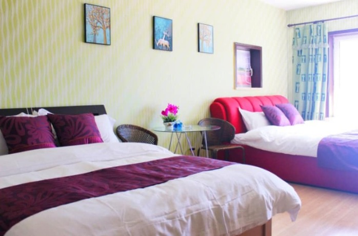 Imagen de la habitación del Hotel Dalian Tinghai Holiday Apartment. Foto 8