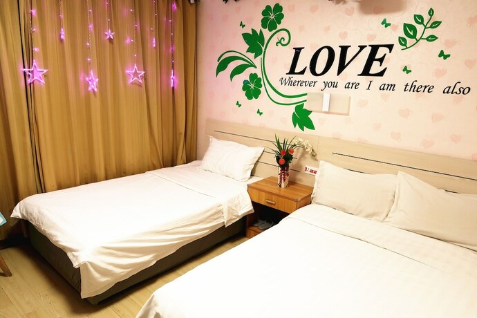 Imagen de la habitación del Hotel Dalian Venus Apartment. Foto 16