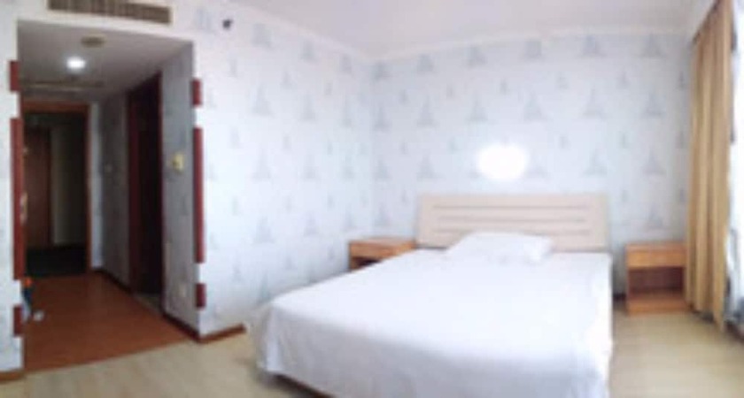 Imagen de la habitación del Hotel Dalian Venus Apartment. Foto 17