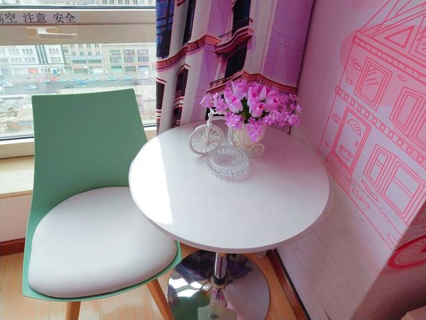 Imagen de la habitación del Hotel Dalian Venus Apartment. Foto 19