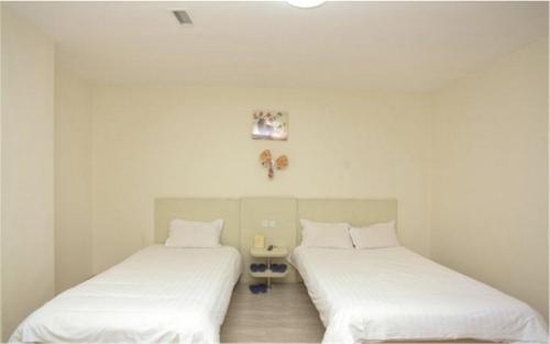 Imagen de la habitación del Hotel Dalian Weiba Inns &. Foto 8