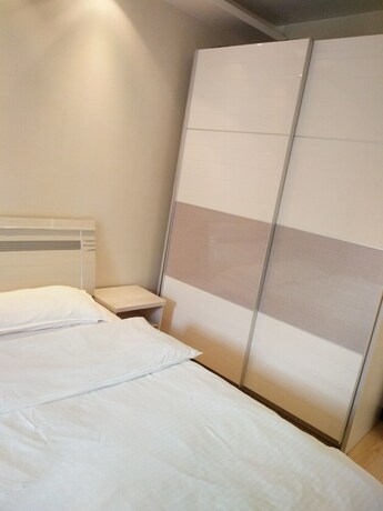 Imagen general del Hotel Dalian Xiuzhu Building Apartment. Foto 12