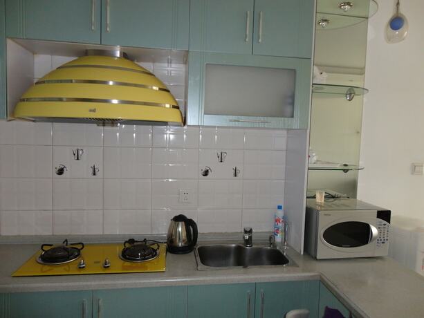 Imagen de la habitación del Hotel Dalian Xiuzhu Building Apartment. Foto 18