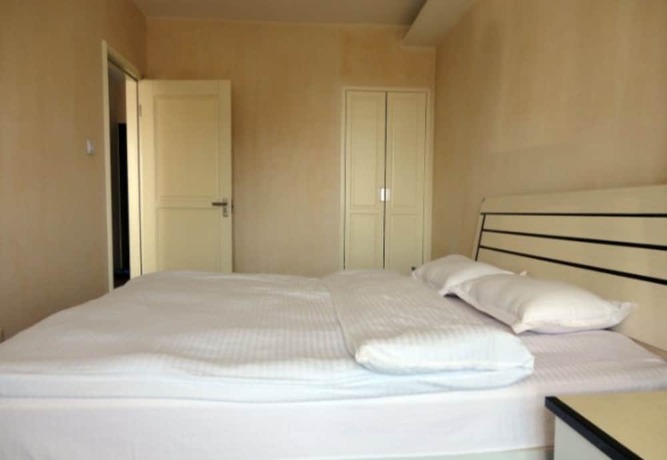 Imagen de la habitación del Hotel Dalian Xiuzhu Building Apartment. Foto 19