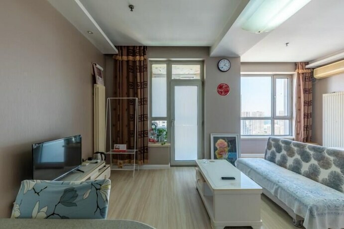 Imagen de la habitación del Hotel Dalian Xiuzhu Building Apartment. Foto 22