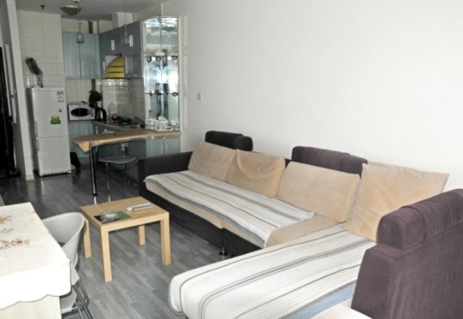 Imagen de la habitación del Hotel Dalian Xiuzhu Building Apartment. Foto 23
