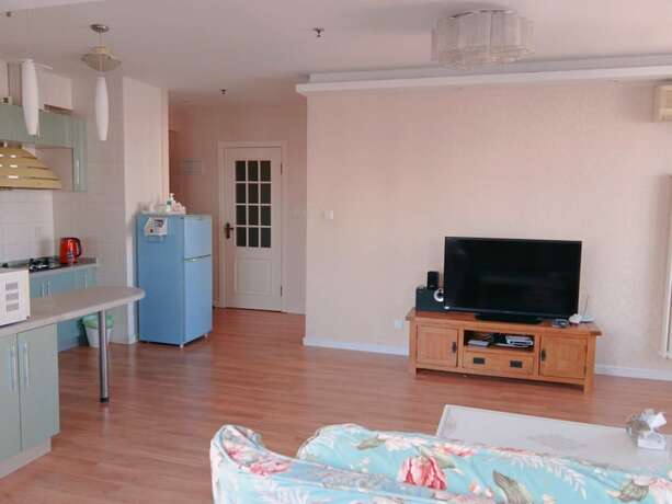 Imagen de la habitación del Hotel Dalian Xiuzhu Building Apartment. Foto 25