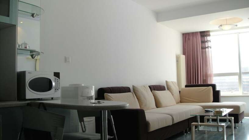 Imagen de la habitación del Hotel Dalian Xiuzhu Building Apartment. Foto 27