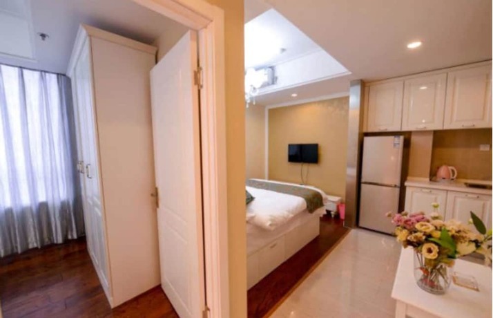 Imagen de la habitación del Hotel Dalian Yijia Apartment Sanba Square. Foto 9