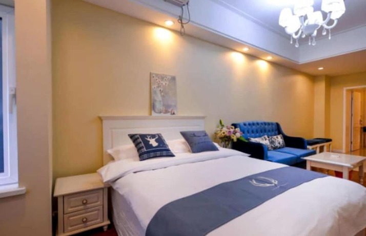 Imagen de la habitación del Hotel Dalian Yijia Apartment Sanba Square. Foto 11