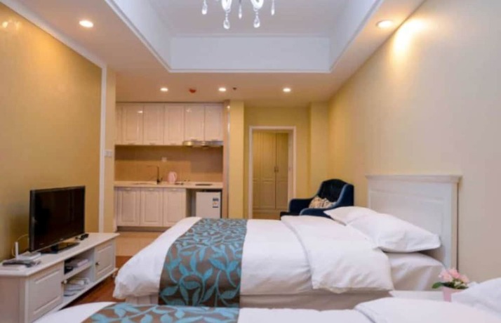 Imagen de la habitación del Hotel Dalian Yijia Apartment Sanba Square. Foto 12