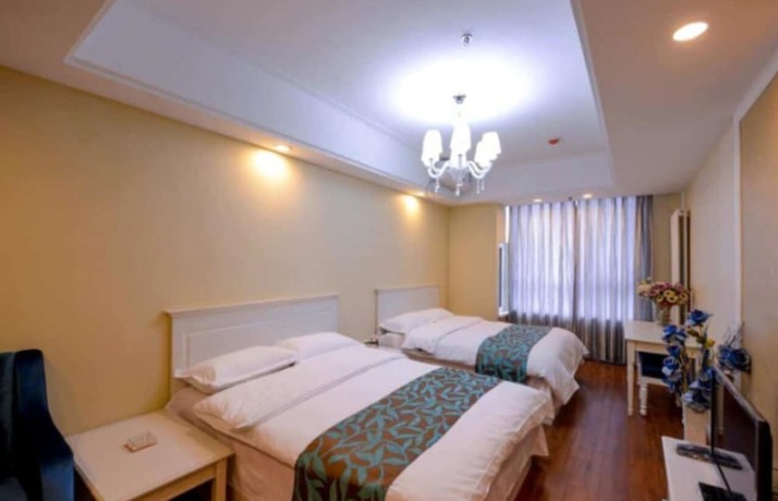 Imagen de la habitación del Hotel Dalian Yijia Apartment Sanba Square. Foto 16
