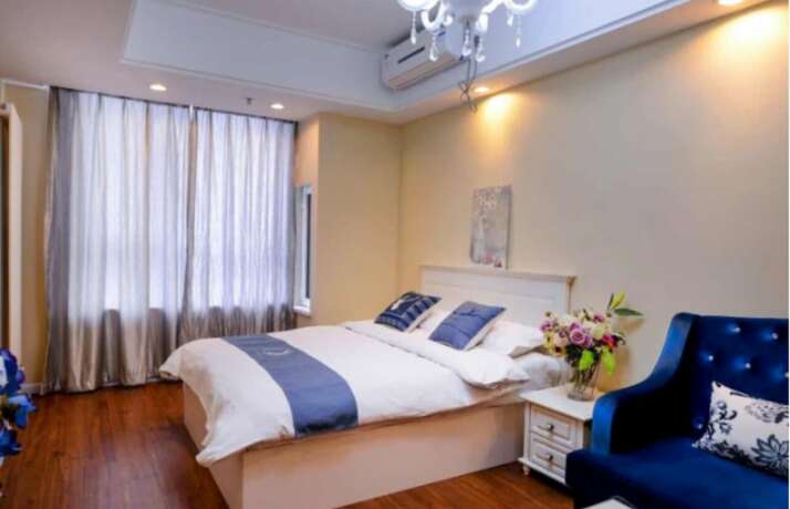 Imagen de la habitación del Hotel Dalian Yijia Apartment Sanba Square. Foto 18