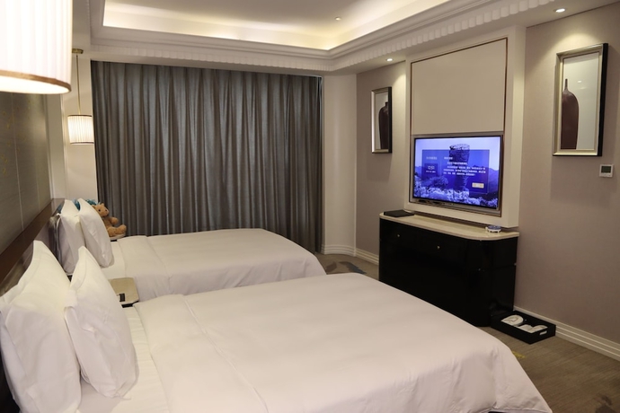 Imagen de la habitación del Hotel Dalong Century Bojun. Foto 11
