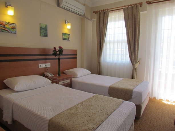 Imagen de la habitación del Hotel Dalyan Palmiye Resort. Foto 6