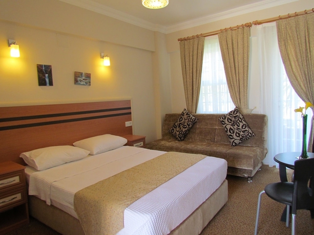Imagen de la habitación del Hotel Dalyan Palmiye Resort. Foto 8