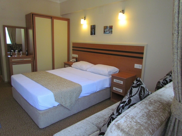 Imagen de la habitación del Hotel Dalyan Palmiye Resort. Foto 9