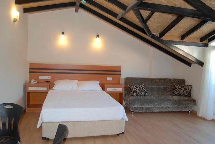 Imagen de la habitación del Hotel Dalyan Palmiye Resort. Foto 12
