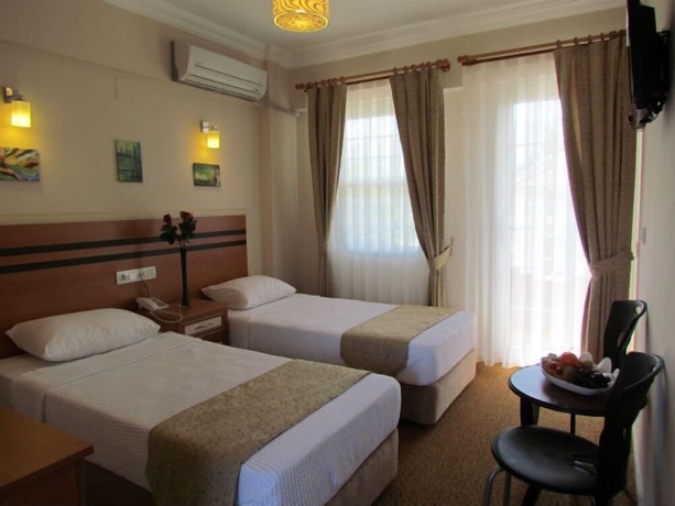 Imagen de la habitación del Hotel Dalyan Palmiye Resort. Foto 13