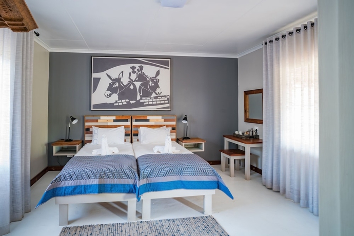 Imagen de la habitación del Hotel Damara Mopane Lodge. Foto 6