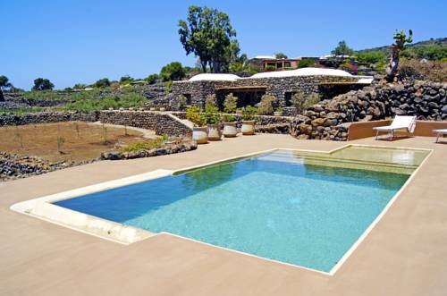 Imagen de la habitación del Hotel Dammusi Sciuvechi Resort. Foto 13