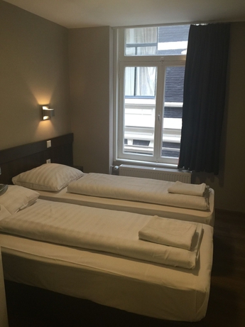 Imagen de la habitación del Hotel Damrak-Inn. Foto 5