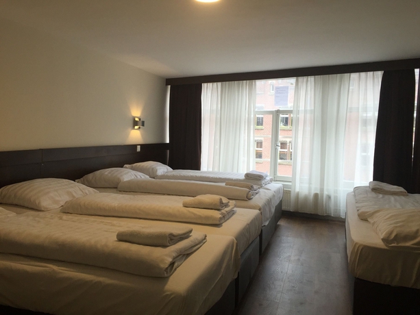 Imagen de la habitación del Hotel Damrak-Inn. Foto 12