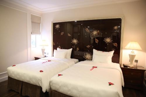 Imagen de la habitación del Hotel Damsels Hanoi Boutique. Foto 6