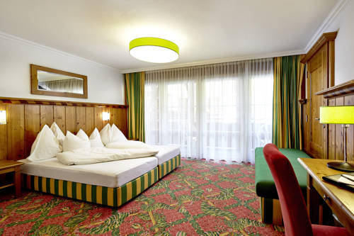 Imagen de la habitación del Hotel Das Alpenwelt Resort. Foto 5