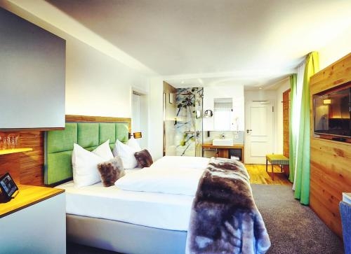 Imagen de la habitación del Hotel Das Aunhamer Suite & Spa Hotel. Foto 6