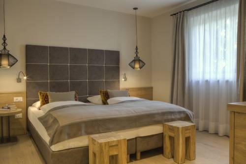 Imagen de la habitación del Hotel Das Grafenstein Familienresidence. Foto 4