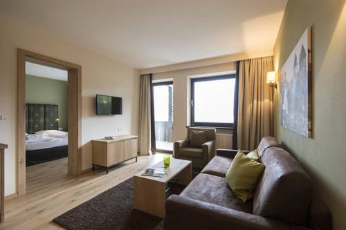 Imagen de la habitación del Hotel Das Grafenstein Familienresidence. Foto 7