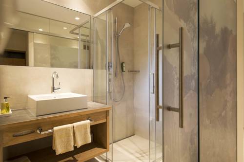 Imagen de la habitación del Hotel Das Grafenstein Familienresidence. Foto 8