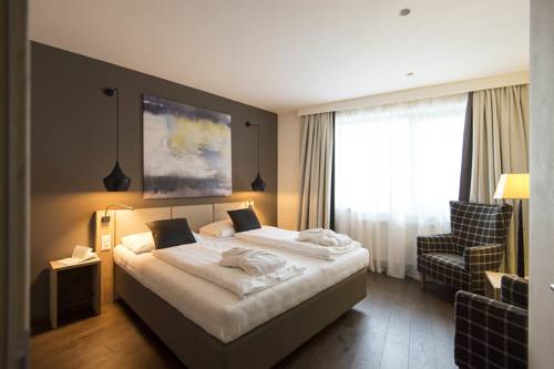 Imagen de la habitación del Hotel Das Grafenstein Familienresidence. Foto 12