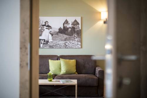 Imagen de la habitación del Hotel Das Grafenstein Familienresidence. Foto 16