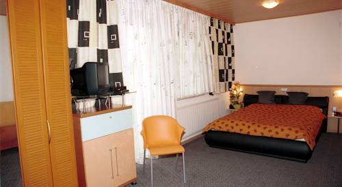 Imagen de la habitación del Hotel Das Mittelpunkt. Foto 11