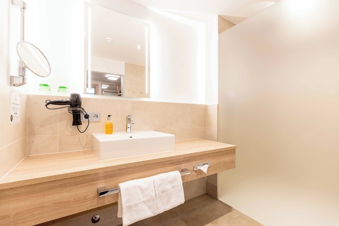 Imagen de la habitación del Hotel Das Walchsee Aktivresort. Foto 10