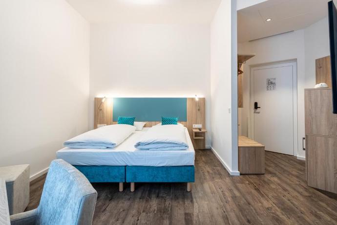 Imagen de la habitación del Hotel DaunTown Rooms - Self Check-In. Foto 2