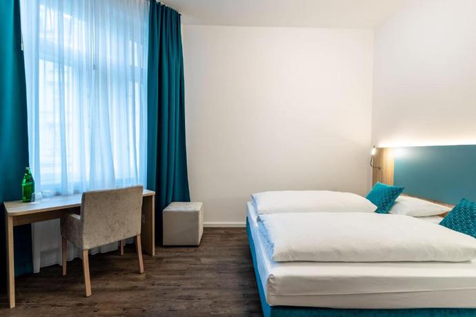 Imagen de la habitación del Hotel DaunTown Rooms - Self Check-In. Foto 3